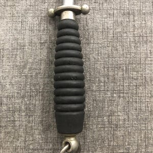May include: A knife sharpener with a black, ridged handle and a silver metal guard and ring. The blade is visible and marked "GERMANY". The handle is approximately 4 inches long.