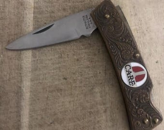 Sällsynt Kutmaster USA Drop Point Lockback Care fällbar fickkniv, mässingshandtag
