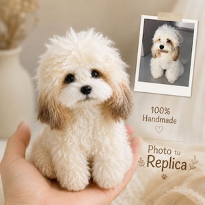 May include: A small, handmade plush dog with cream-colored, curly fur and brown-tipped ears. The text 100% Handmade and Photo to Replica is visible next to a small photograph of a similar dog, featuring dark eyes and a black nose.