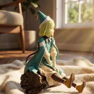 May include: A figurine of a character with short blonde hair wearing a teal pointed hat, a matching teal cape over a cream-colored long-sleeved garment, and brown boots. The character is seated on a textured brown log, facing toward the right side.