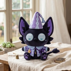 May include: A plush toy of a black cat with large light blue eyes featuring heart-shaped pupils. The cat wears a light purple pointed hat with a tassel, a matching light purple collared jacket with a gold moon charm, and has purple paw pads.