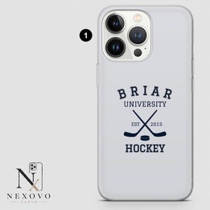 May include: A white phone case with a navy blue Briar University Hockey design. The design includes crossed hockey sticks, a puck, and the text "EST 2015". The case has a clear, protective design.