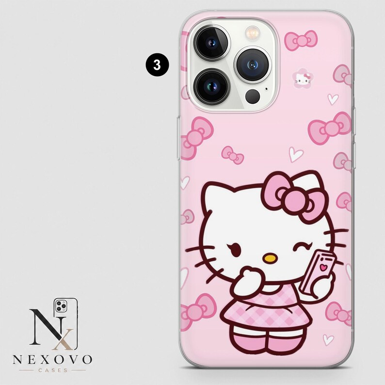 May include: Pink phone case featuring a Hello Kitty design. The case has a repeating pattern of bows and hearts. Hello Kitty is holding a phone and wearing a pink dress. The case is for a phone with three camera lenses.