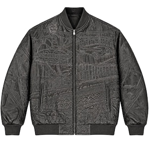 May include: A black bomber jacket featuring an all-over embossed design with intricate patterns, including a car, the text WASHINGTON, and various swirling motifs. The jacket has a front zipper closure, ribbed collar, cuffs, and hem, and two pockets.