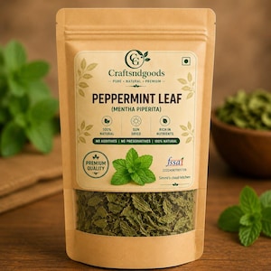 May include: A brown kraft paper stand-up pouch containing dried peppermint leaves. The label features the text Craftsndgoods, Peppermint Leaf, Mentha Piperita, 100% Natural, Sun Dried, Rich in Nutrients, No Additives, No Preservatives, and FSSAI.