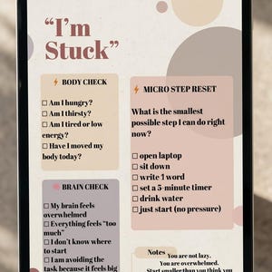 May include: A digital tablet displays a self-help guide titled "I'm Stuck." The guide includes sections for body and brain checks, and micro-step resets. The color scheme is soft, with beige, peach, and brown tones.