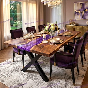 May include: A rectangular dining table featuring a natural live-edge wood surface with a central translucent purple resin inlay, supported by a black metal X-shaped base, surrounded by six dark purple upholstered chairs with black wooden frames.