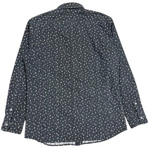 May include: A long-sleeve button-down shirt in a dark charcoal gray color featuring a repeating white pattern of small, stylized bird silhouettes. The garment includes a standard collar, a buttoned front placket, and cuffs with two buttons each.