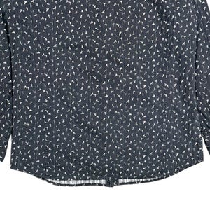 May include: A long-sleeve button-down shirt in dark charcoal gray featuring a repeating pattern of small white bird silhouettes and thin vertical pinstripes. The garment includes a standard collar, a front button placket, and cuffs with buttons.
