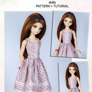May include: Image of a cotton summer dress pattern and tutorial for dollfie dream dolls. The dress is gray with a pink heart pattern and white lace trim. The image includes three dolls wearing the dress.