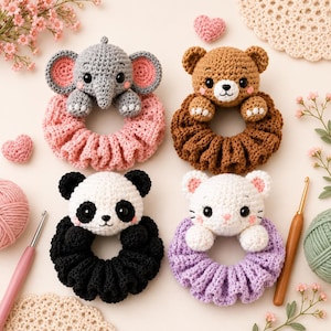 May include: Four handmade crochet baby toys. The toys feature an elephant, bear, panda, and cat, each with a different color scrunchie. The elephant has a gray body and pink ears. The bear is brown. The panda is black and white. The cat is white and purple.