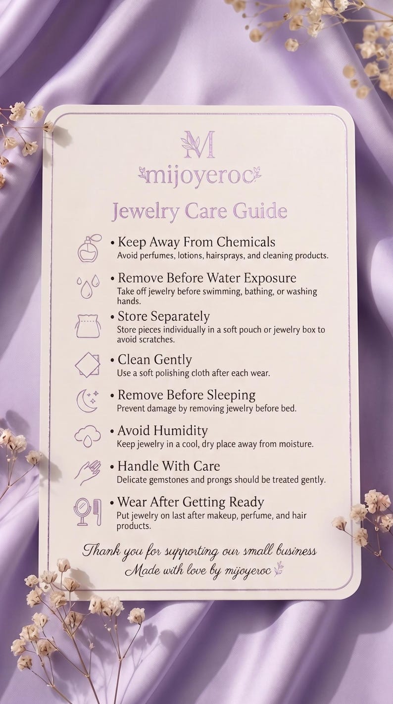 May include: A rectangular white jewellery care guide card with rounded corners featuring the text mijoyeroc and instructions to keep away from chemicals, remove before water exposure, store separately, clean gently, remove before sleeping, avoid humidity, handle with care, and wear after getting ready.