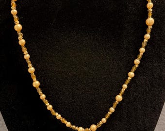 handmade mid length beaded necklace with vintage flower avon pendant