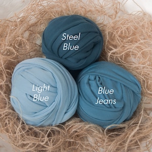 May include: Three balls of fabric in shades of blue. The balls are labeled "Steel Blue", "Light Blue", and "Blue Jeans".