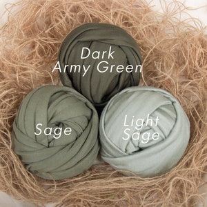 May include: Three balls of fabric in shades of green. The balls are labeled "Dark Army Green", "Sage", and "Light Sage".