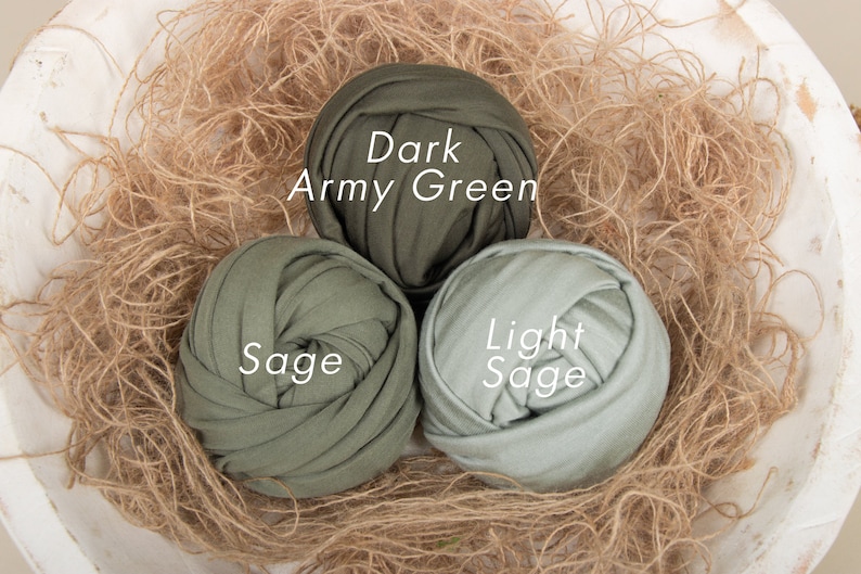 May include: Three balls of fabric in shades of green. The balls are labeled "Dark Army Green", "Sage", and "Light Sage".