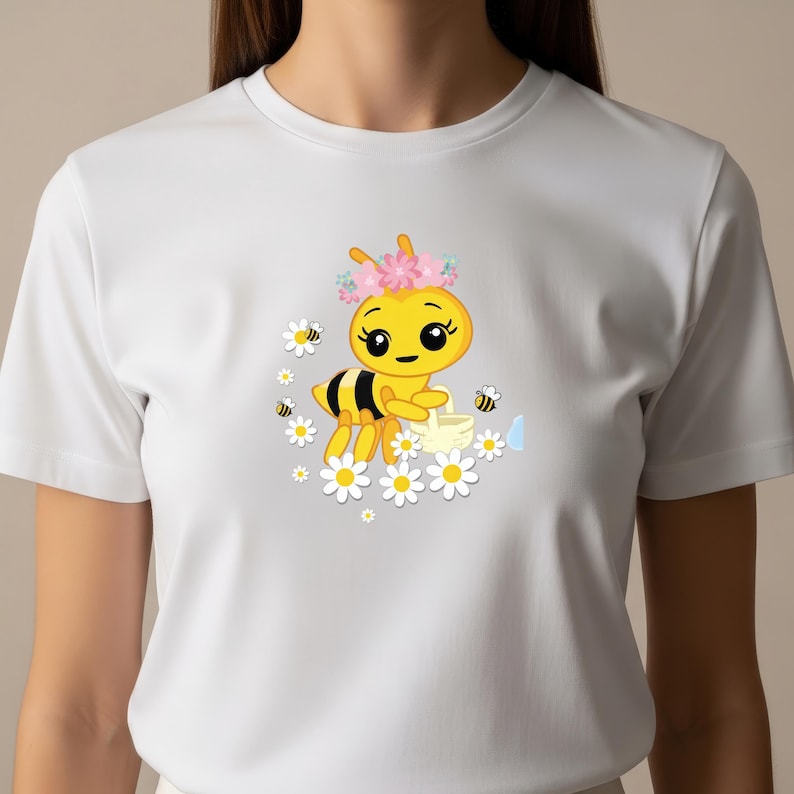 May include: White t-shirt featuring a cartoon bee with a flower crown, holding a watering can, surrounded by daisies and other bees. The bee has black and yellow stripes. The design is centered on the shirt.