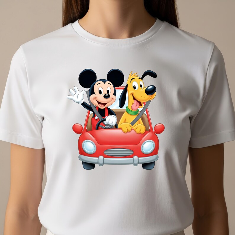 May include: A white short-sleeve t-shirt featuring a graphic print of Mickey Mouse and Pluto riding in a bright red convertible car. Mickey Mouse is in the driver seat waving, while Pluto sits in the passenger seat with a green collar.