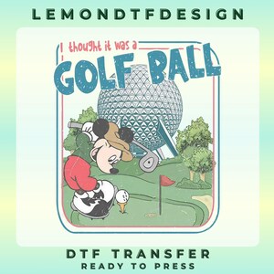 May include: A graphic design featuring a cartoon mouse wearing a tan hat, green shirt, and red shorts, swinging a golf club on a green course. Behind the mouse is a large geodesic dome structure. The text reads I thought it was a GOLF BALL.