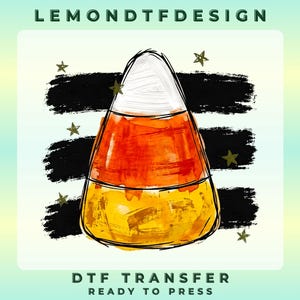 May include: A candy corn graphic with white, orange, and yellow sections, outlined in black. Behind it are three horizontal black brush strokes and small gold stars. The text LEMONDTFDESIGN appears at the top, and DTF TRANSFER READY TO PRESS at the bottom.