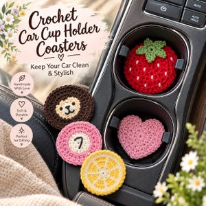 May include: A set of five round and heart-shaped crochet car cup holder coasters featuring various designs including a red strawberry, a brown lion face, a pink circle with a number seven, a pink heart, and a yellow citrus slice pattern.