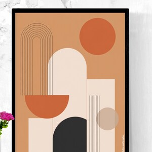 Puede incluir: Impresión artística abstracta en un marco negro. La obra presenta formas geométricas en tonos naranja, beige y negro. Destacan un gran círculo naranja y un semicírculo. El diseño incluye arcos y líneas verticales.