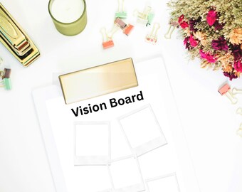May include: A white clipboard with a gold clip featuring the text Vision Board and four blank photo frames. Surrounding items include a gold stapler, a green candle, assorted colorful binder clips, and a bouquet of dried pink and orange flowers.