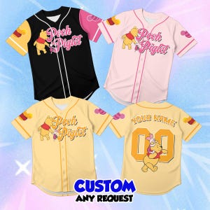 May include: Three short-sleeve button-down baseball jerseys featuring Winnie the Pooh and Piglet graphics. One jersey is black, one is light pink, and one is yellow. The yellow jersey back displays the text YOUR NAME and the number 00.