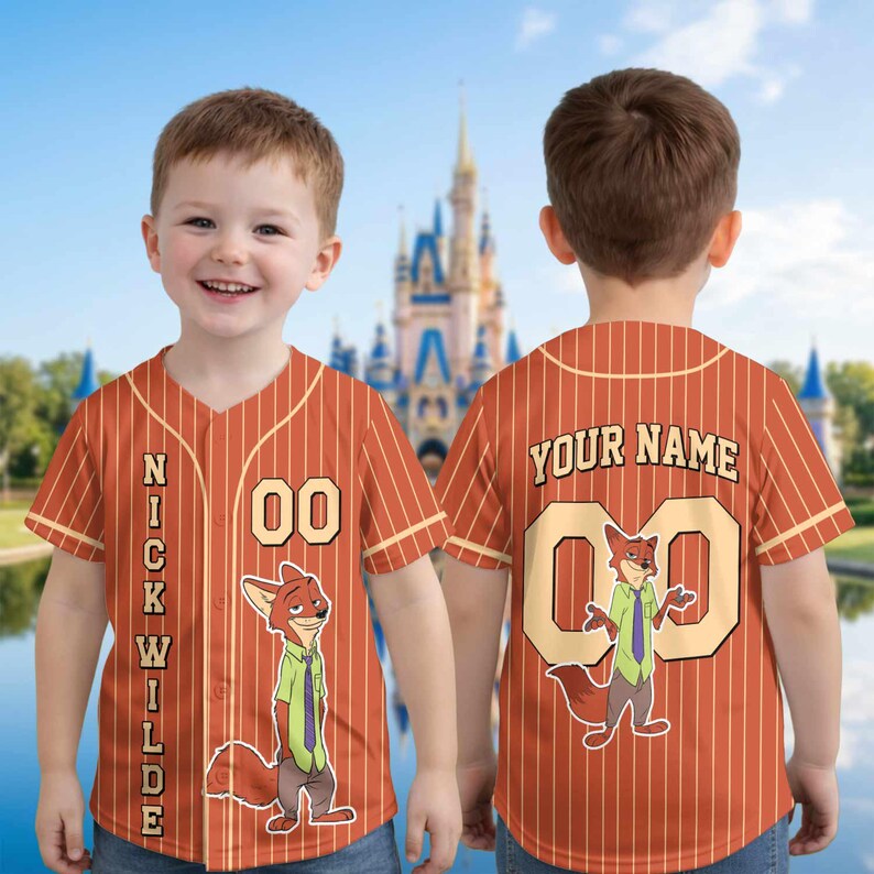 May include: Orange and white striped baseball jersey featuring the character Nick Wilde from Zootopia. The jersey has the name "NICK WILDE" down the front and the number "00". The back of the jersey says "YOUR NAME" and has the number "00" with the Nick Wilde character.