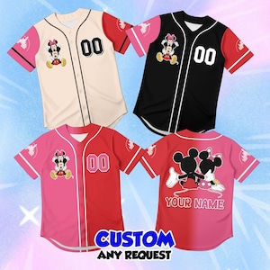 May include: Four short-sleeve button-down baseball jerseys featuring Mickey and Minnie Mouse graphics. The shirts come in cream, black, and pink colorways with the number 00 on the front. One jersey back displays the text YOUR NAME.