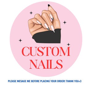 May include: A circular pink graphic featuring an illustration of a hand with long almond-shaped nails with black tips. The text CUSTOM NAILS is printed in red below the hand. The text PLEASE MESAGE ME BEFORE PLACING YOUR ORDER! THANK YOU<3 is below.