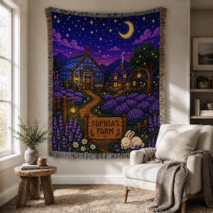 May include: A woven tapestry depicting a nighttime farm scene with a greenhouse, cottage, and lavender fields under a starry sky and crescent moon. The sign reads "Sophia's Farm" with a sleeping rabbit. The tapestry is fringed.