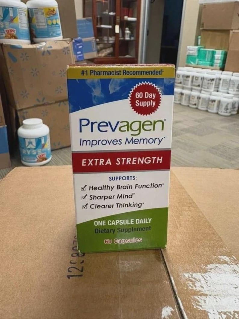 May include: A rectangular box of Prevagen Extra Strength dietary supplement. The packaging is blue, white, red, and green, featuring the text #1 Pharmacist Recommended, 60 Day Supply, Improves Memory, and lists support for healthy brain function.