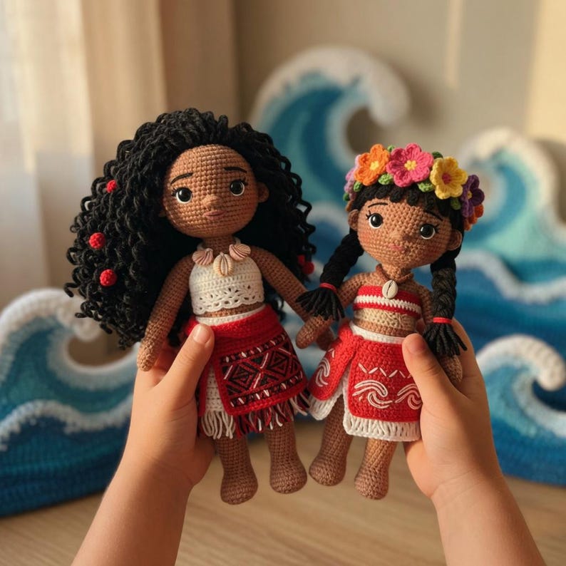 May include: Two handmade crochet dolls, each with dark skin and black hair. One doll has curly hair and red accents, the other has braids and a floral crown. Both dolls wear red and white outfits and are held up by a person.