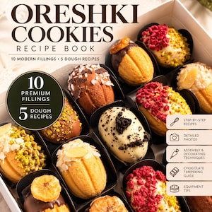 Peut inclure: Un livre de recettes intitulé ORESHKI COOKIES proposant 10 garnitures modernes et 5 recettes de pâte. La couverture présente une boîte de biscuits en forme de noix avec diverses garnitures comme des pistaches, framboises et chocolat.