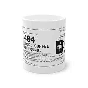 May include: A white ceramic mug featuring black printed text and graphics. The design includes the text 404 ERROR: COFFEE NOT FOUND, along with technical programming-themed phrases and a small icon of a coffee mug with a lightning bolt symbol.