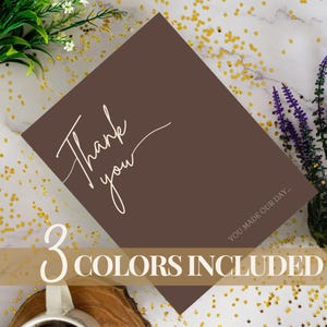 May include: A square brown card featuring the white cursive text Thank you and the smaller white text YOU MADE OUR DAY. A horizontal banner across the bottom displays the white text 3 COLORS INCLUDED in a serif font against a brown background.