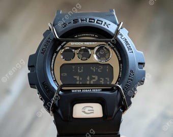 Black G-Shock with leather band military bumper guard multifunction