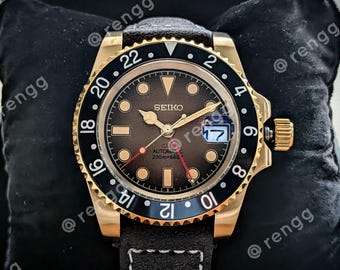 Reloj Seiko NH34A GMT automático marrón con detalles dorados, 40 mm, cristal de zafiro, 24 joyas.