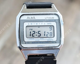 RARE Seiko ALBA Lithium Digital Watch 33mm LCD Silver Tone Date Month fresh battery