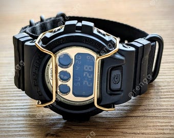 Casio G-Shock Gold tone military style black nato strap