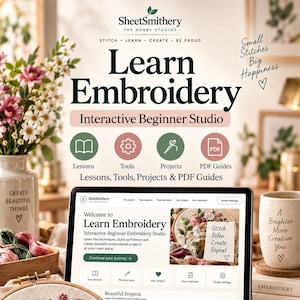 May include: A digital display showing the Learn Embroidery Interactive Beginner Studio interface, accompanied by an embroidery hoop with floral stitching, gold scissors, colorful thread skeins, and printed instructional guides.