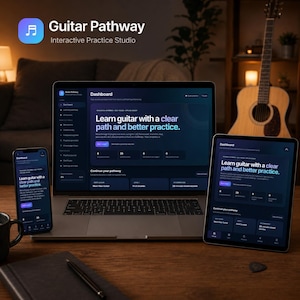 May include: A laptop, a tablet, and a smartphone displaying the Guitar Pathway Interactive Practice Studio dashboard with the text Learn guitar with a clear path and better practice, positioned on a wooden desk with a guitar in the background.