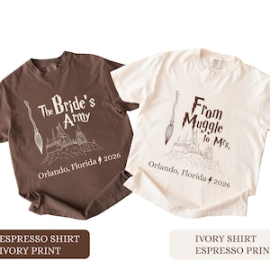 May include: Two t-shirts, one brown and one cream, with matching designs. The brown shirt has the text "The Bride's Army" and the cream shirt says "From Muggle to Mrs." Both shirts feature a broom, castle, and "Orlando, Florida 2026".