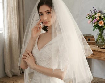 Romantic Fingertip Veil with Double-Layer Puff Tulle, a Vintage Bridal Accessory for your Wedding Day and classic ceremony outfit.