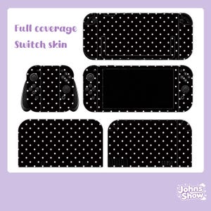 May include: A black and white polka dot Switch skin set. The set includes skins for the console, controllers, and dock. The text "Full coverage Switch skin" is visible in the upper left corner. The brand name "Johns Show" is in the lower right corner.
