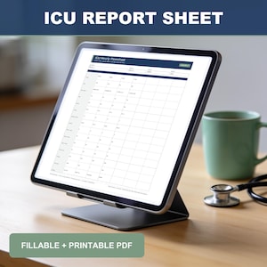 May include: A digital tablet on a stand displaying an ICU Hourly Flowsheet report sheet. The screen shows a grid for medical data entry. A stethoscope and a light green mug are visible nearby. The text on the screen reads ICU Hourly Flowsheet.