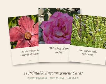 May include: Three rectangular encouragement cards featuring floral imagery. The left card shows a pink hibiscus with the text 'You don't have to carry it all alone.' The center card shows a pink rose with 'Thinking of you today.' The right card shows green basil with 'You are enough, right now.'