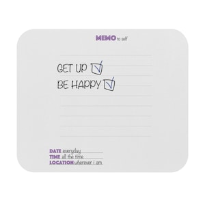 May include: A white rectangular memo pad with rounded corners featuring the purple text MEMO to self at the top. The pad includes the printed text GET UP and BE HAPPY with check boxes, followed by lines for DATE everyday, TIME all the time, and LOCATION wherever i am.