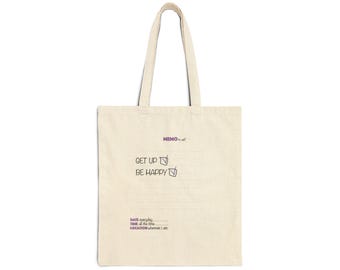 May include: A beige canvas tote bag with two shoulder straps. The front features purple and black text that reads: MEMO to self, GET UP, BE HAPPY, DATE everyday, TIME all the time, LOCATION wherever I am, along with two checkbox icons.